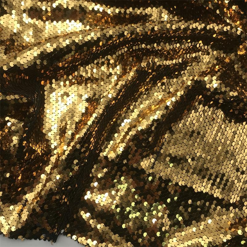 Warm gold sequin cloth, draped and catching the light